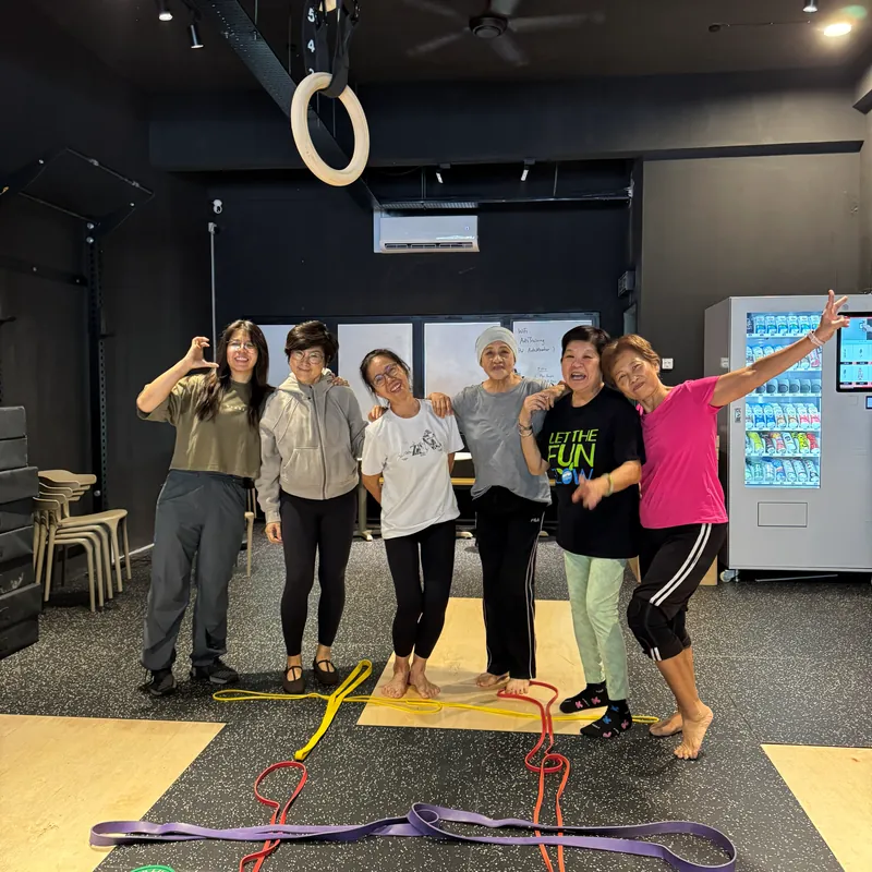 Six senior members training with resistance bands on the gym floor at ANTS Training Club in Kelana Jaya